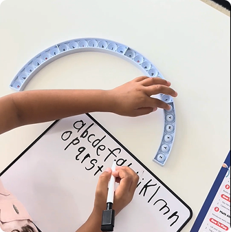 Say a letter sound or introduce a new letter ("This is B, it says /b/").